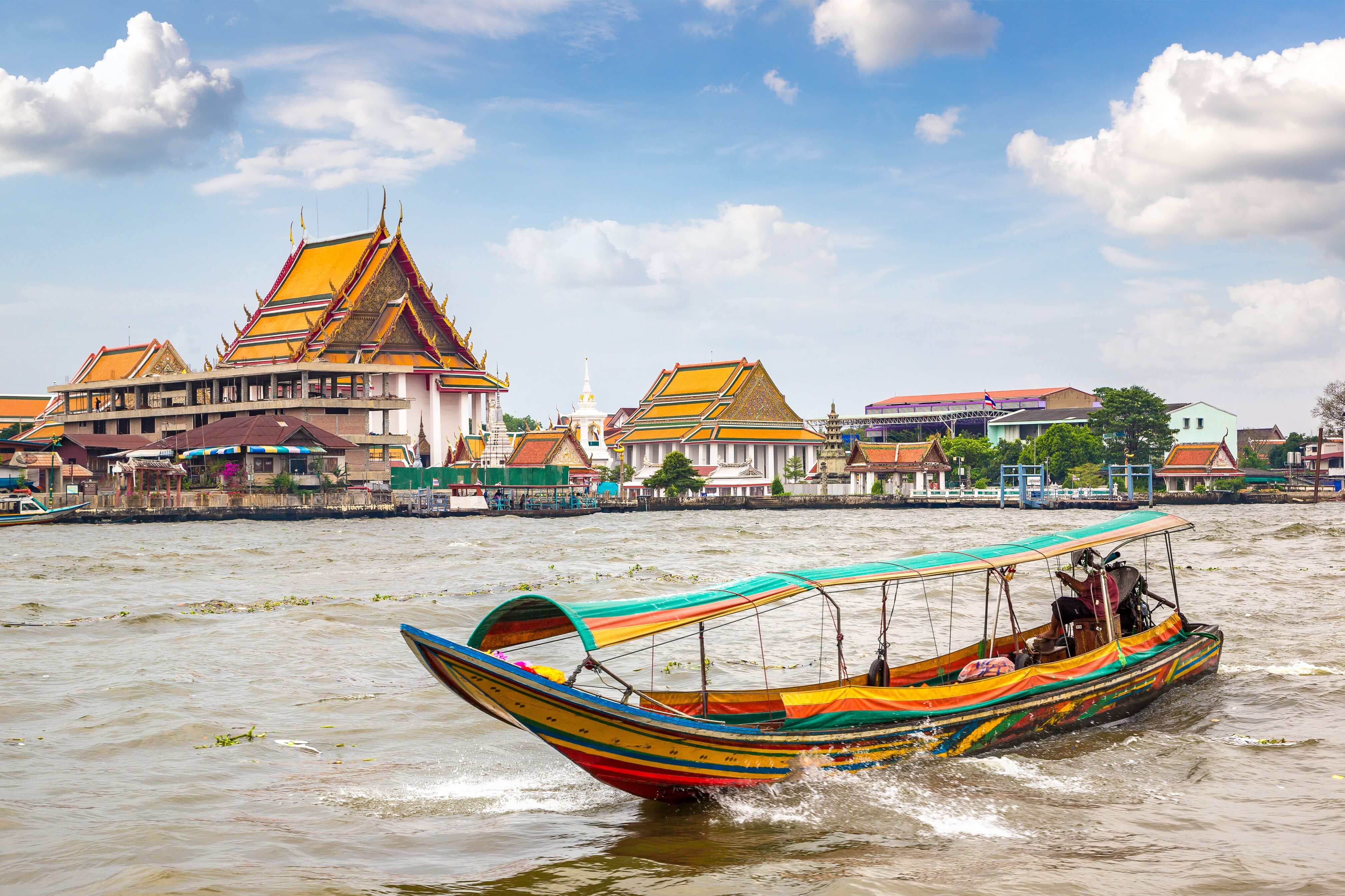 Long tail boat in Chao Phraya river in Bangkok, Thailand in a summer day